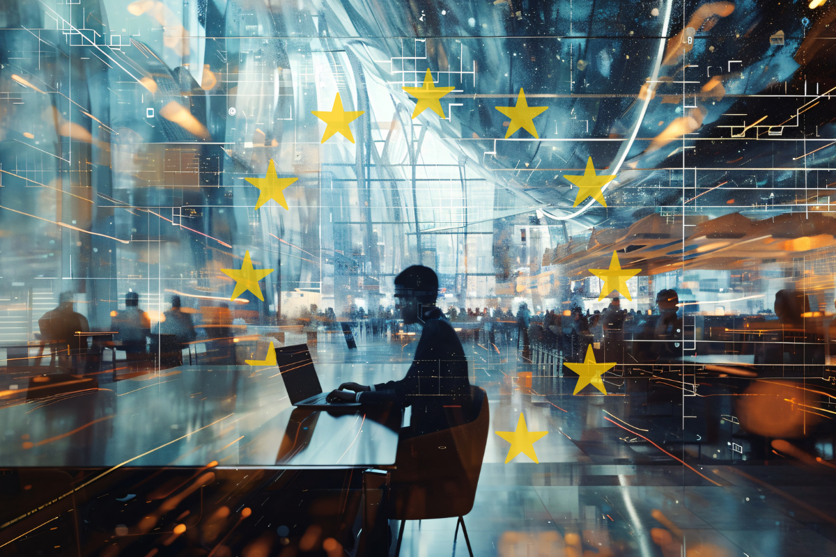 Persona trabajando con ordenador en un entorno digital futurista, sobreimpresionado con la bandera de la Unión Europea. Representación de la psicotecnología, la inteligencia artificial aplicada y los desafíos éticos en el contexto europeo.